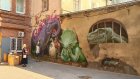 На Московской появилось огромное граффити с динозаврами